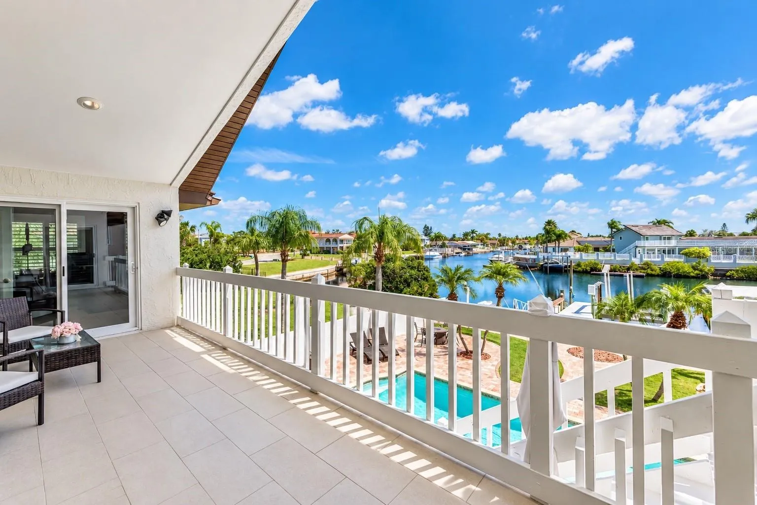 Rear balcony overlooking the pool and canal.
