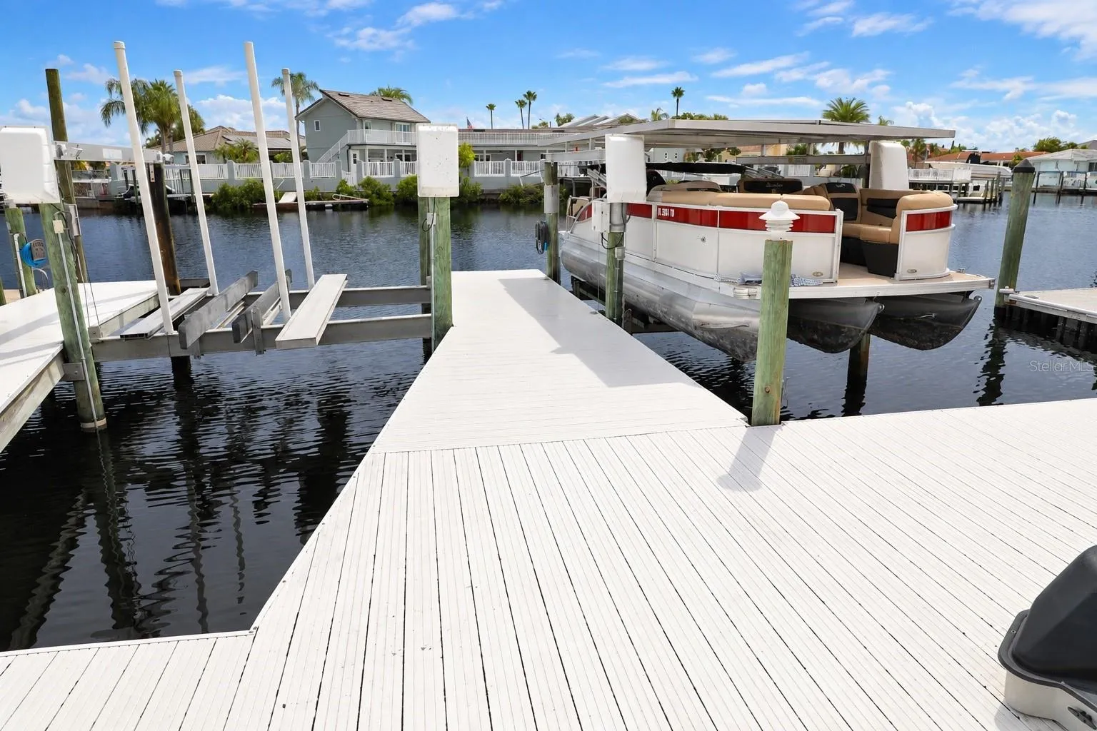 Dock and boat lifts looking across the canal.
