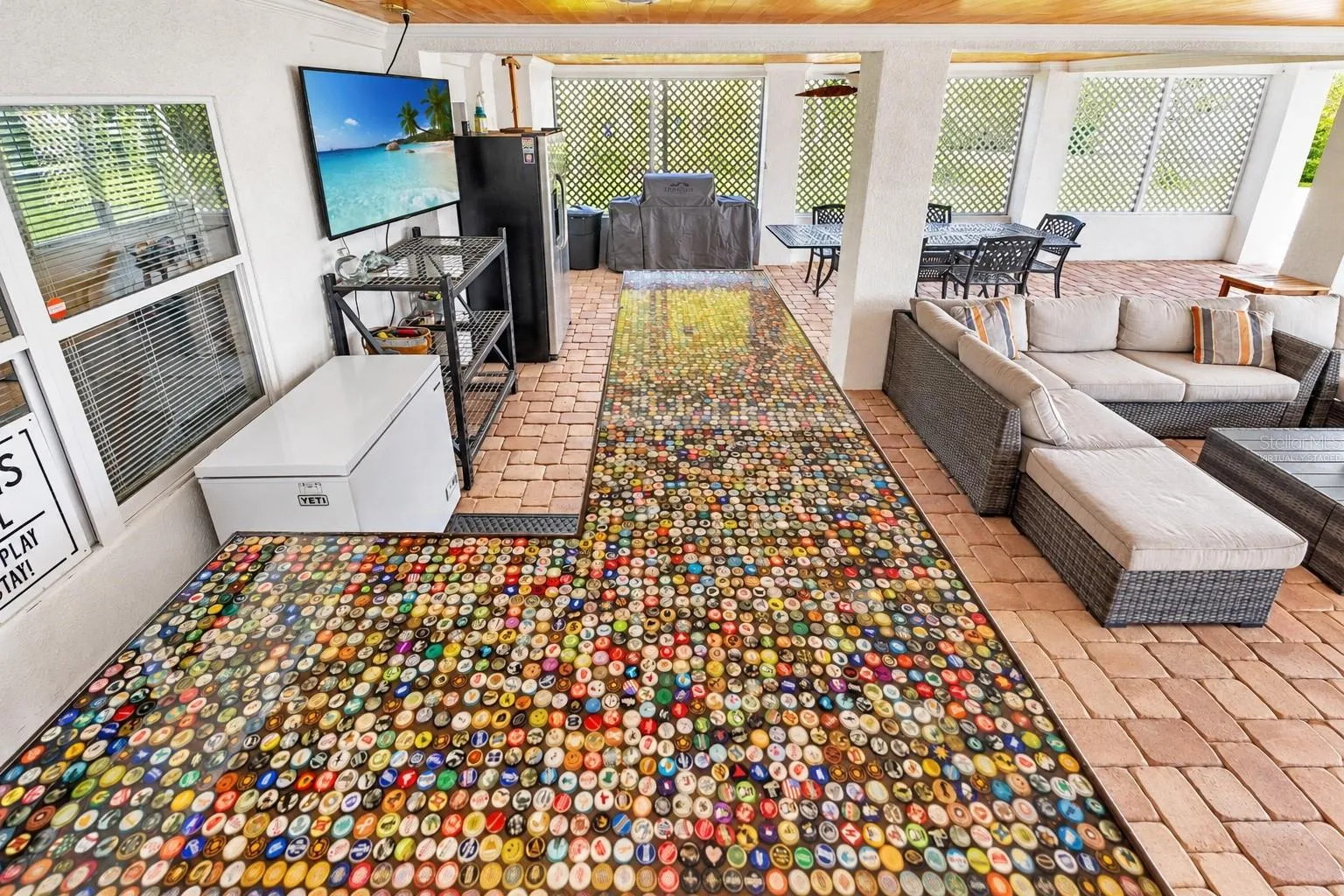 Outdoor bar with custom bottle-cap counter.