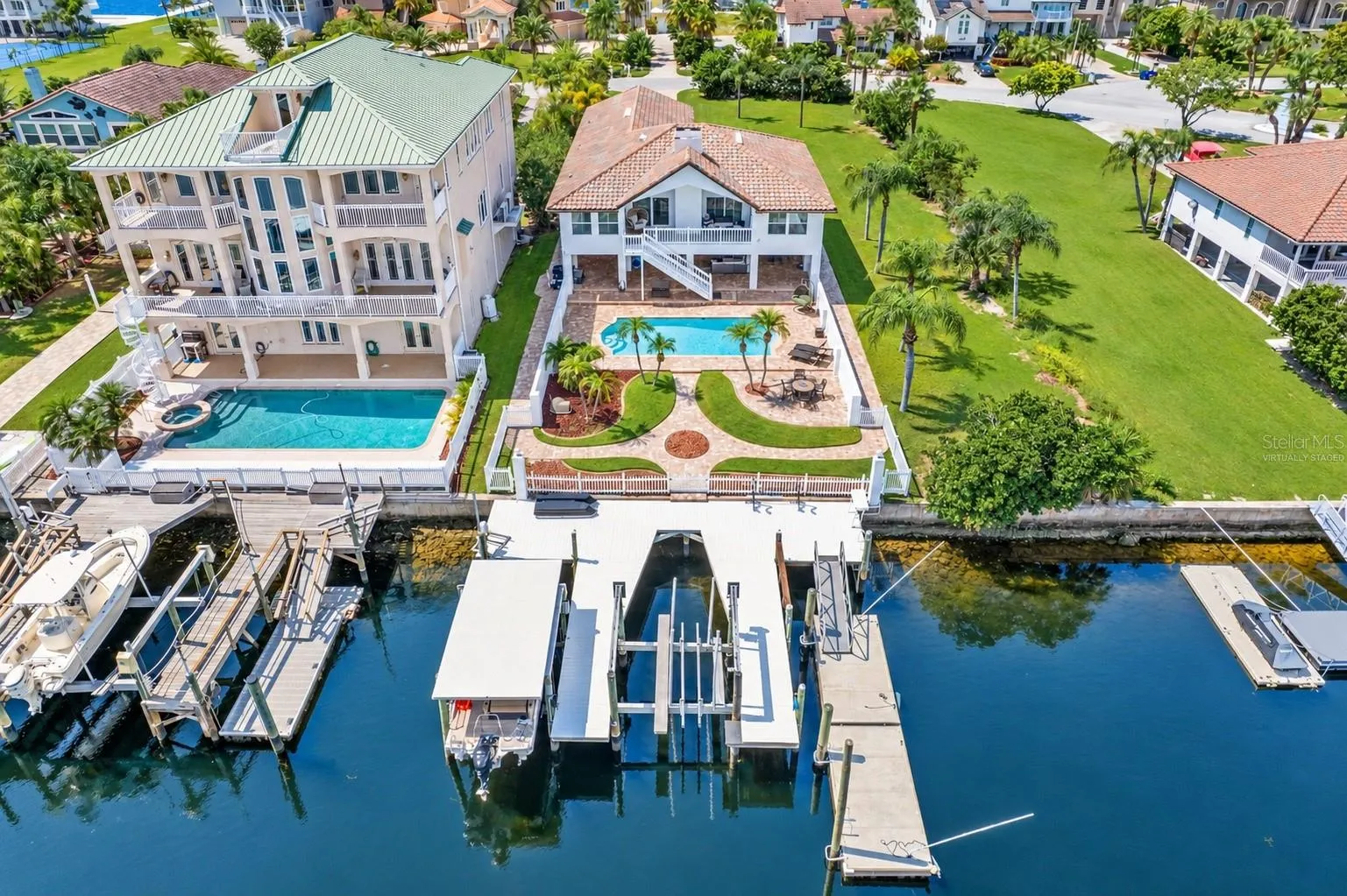Aerial of the home, pool and private dock on the canal.
