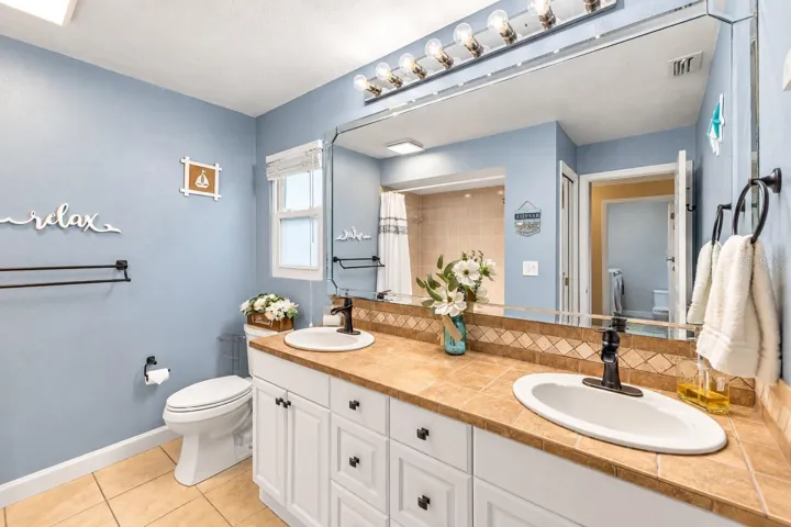 Remodeled guest bath with double vanity.