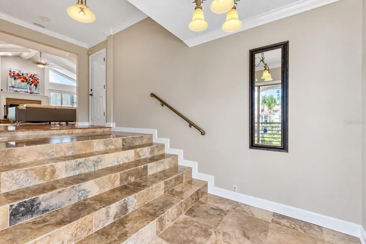 Entry foyer with stairs up to the main living level.