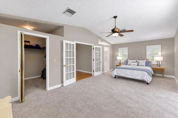 Bedroom 2 with walk-in closet and sitting area.