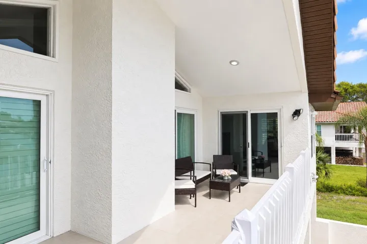 Covered balcony seating area off the second floor.