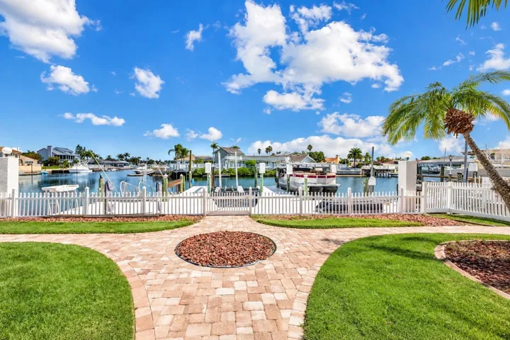 Backyard with fire pit and canal views.