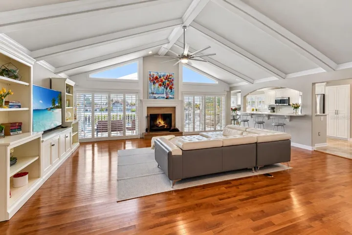 Great room open to the kitchen, with canal-view windows.