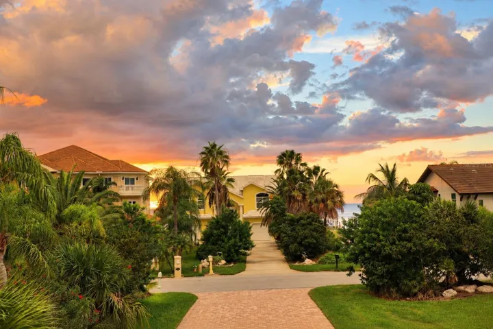 Sunset view from the front balcony with partial Gulf views.