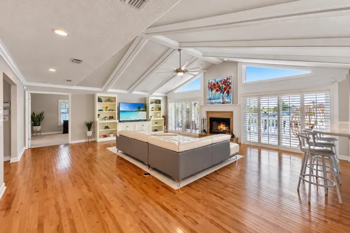 Great room with plantation shutters and bar seating.