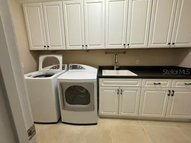 Laundry Room with sink ,folding area and storage