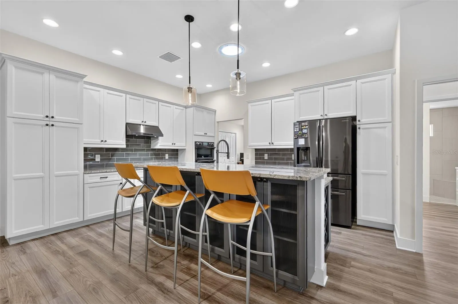 Kitchen with breakfast bar and storage