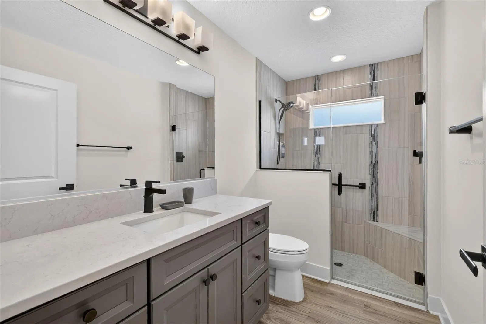 Front bathroom with walk-in tiled shower