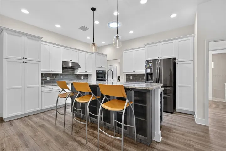 Kitchen with breakfast bar and storage