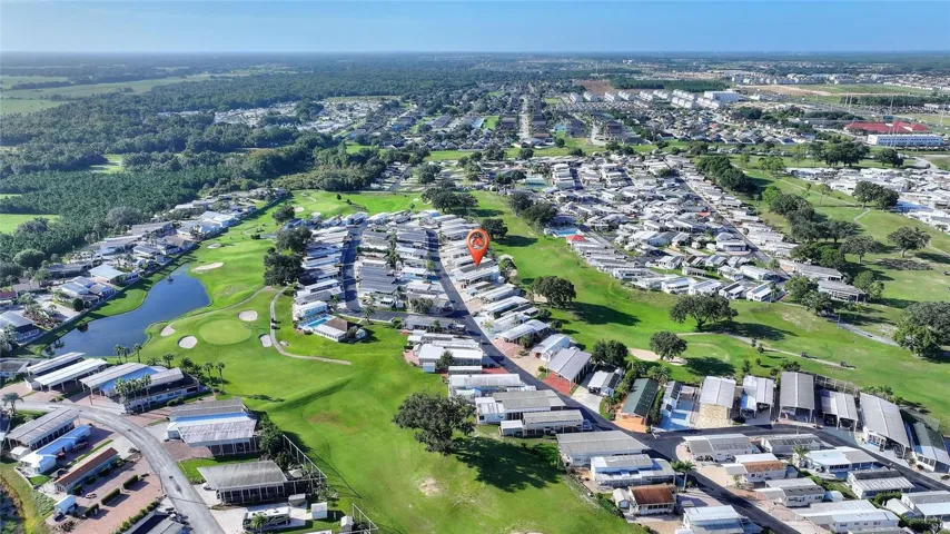 Aerial view backs to golf course close to clubhouse