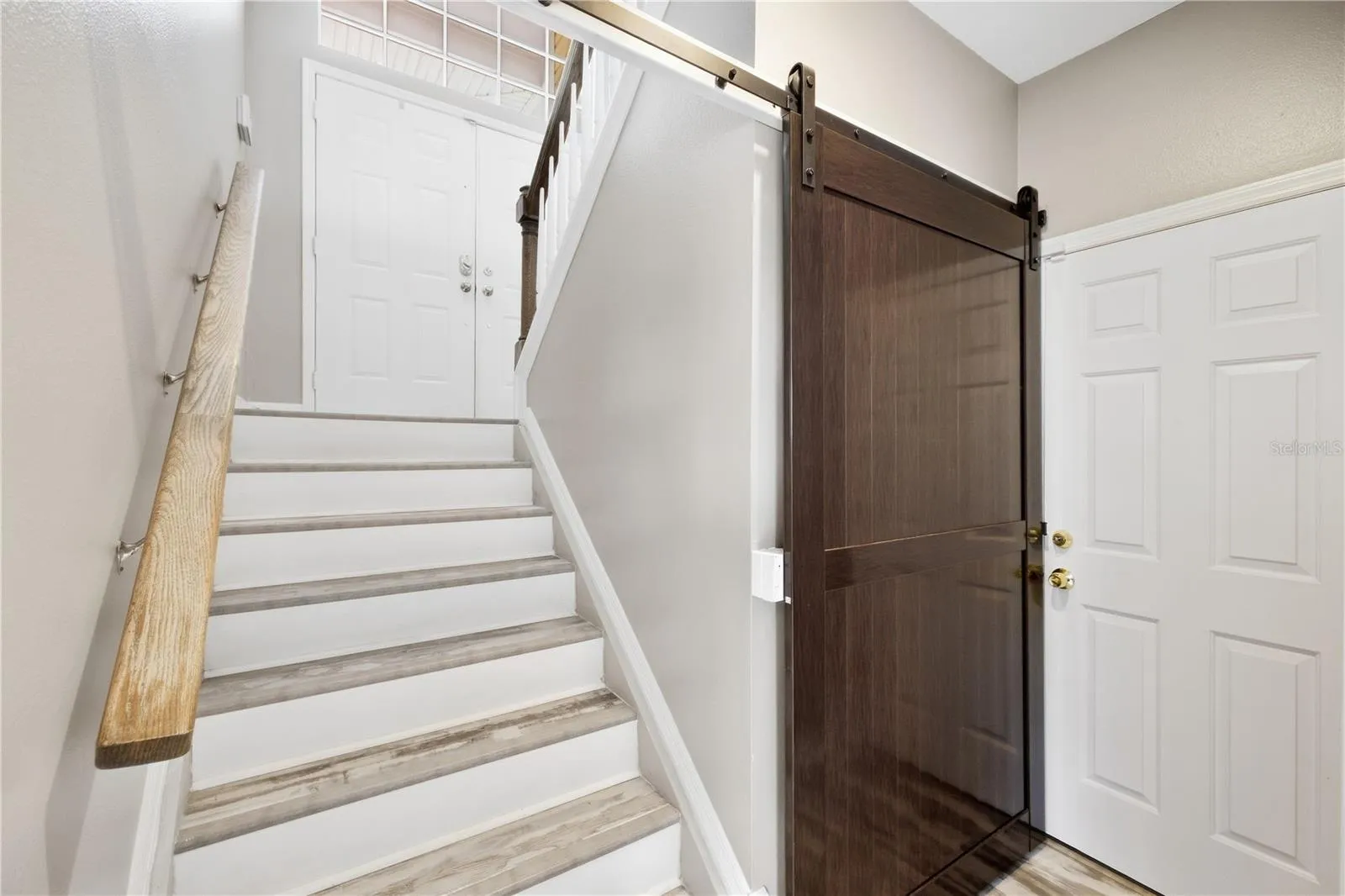 stairs leading down to huge amounts of bonus space or room for in law suite and guests!