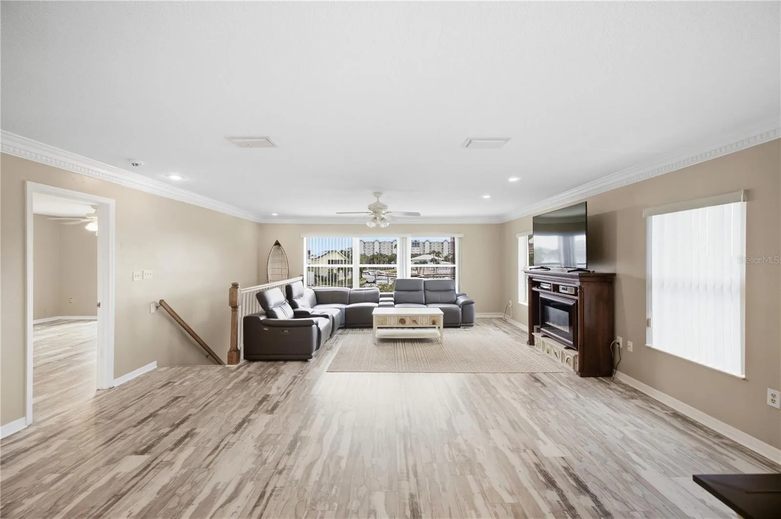Living Room with natural light and gorgeous crown molding!