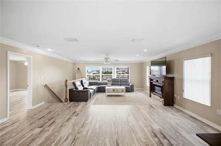 Living Room with natural light and gorgeous crown molding!