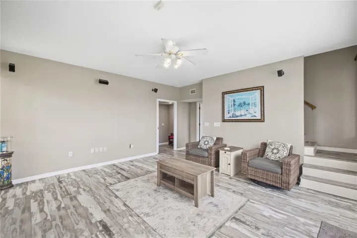 Den downstairs with wood burning fireplace nad additional entrance/exit.