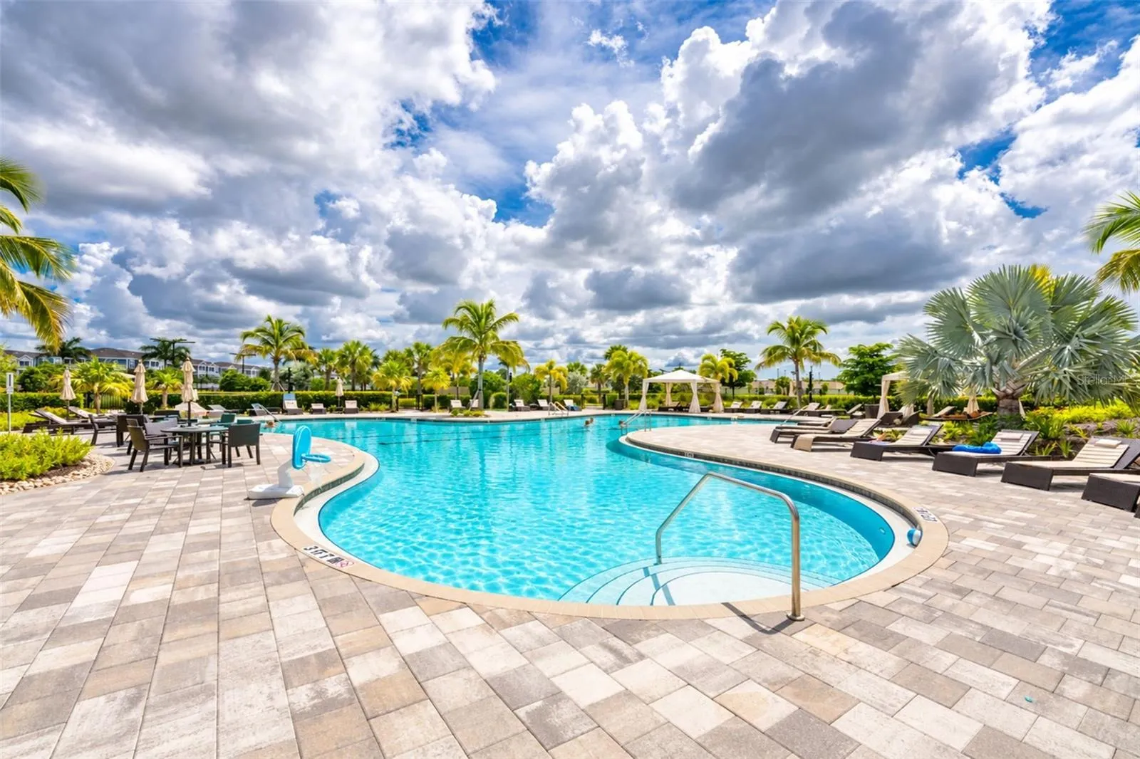 Resort-style community pool with Wi-Fi, convenient electrical outlets, and cabanas available on a first-come, first-served basis—perfect for relaxing and enjoying the Florida sunshine.