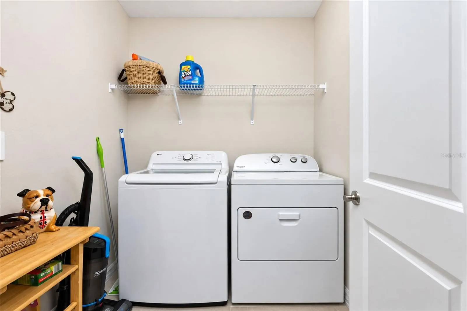 Convenient dedicated interior laundry room offering additional functionality and storage.