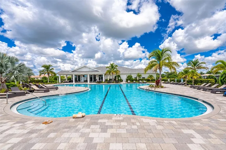 Expansive resort-style community pool surrounded by tropical landscaping, spacious sun decks, lounge seating and first-come, first-served cabanas—the perfect setting to swim, relax and enjoy the Florida sunshine.