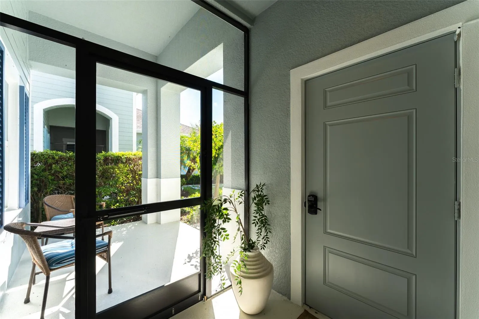 Covered & Screen Enclosed Entryway to Garage