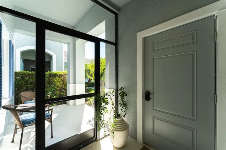 Covered & Screen Enclosed Entryway to Garage