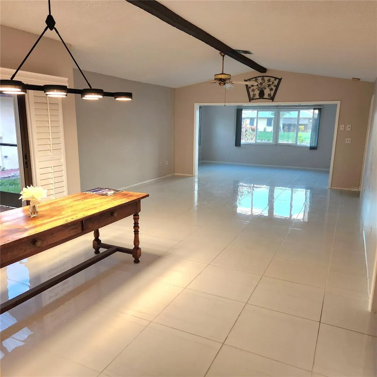 view from entry/foyer.  Dining room to left with beautiful light over table.