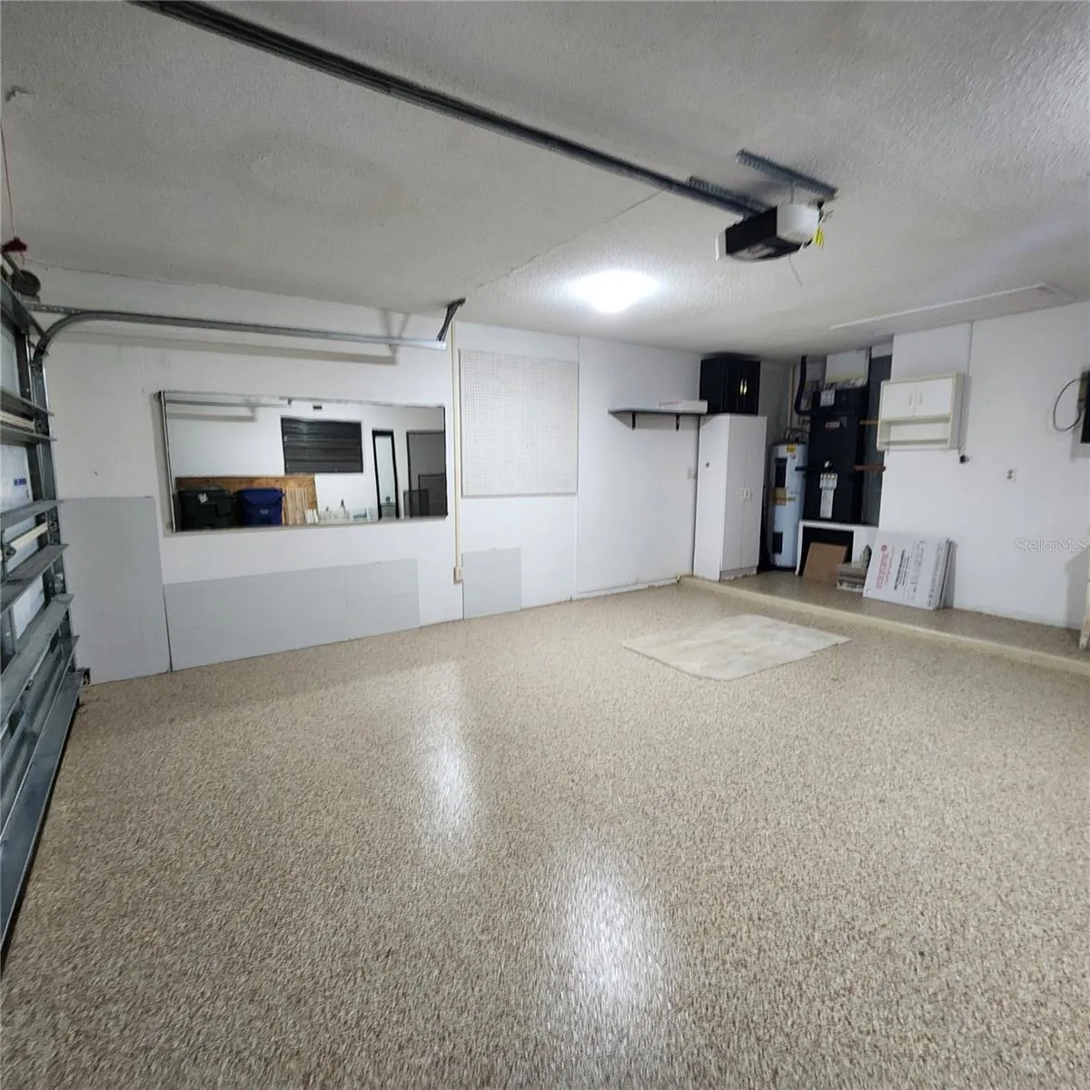 beautiful epoxy floor in garage and lots of spac