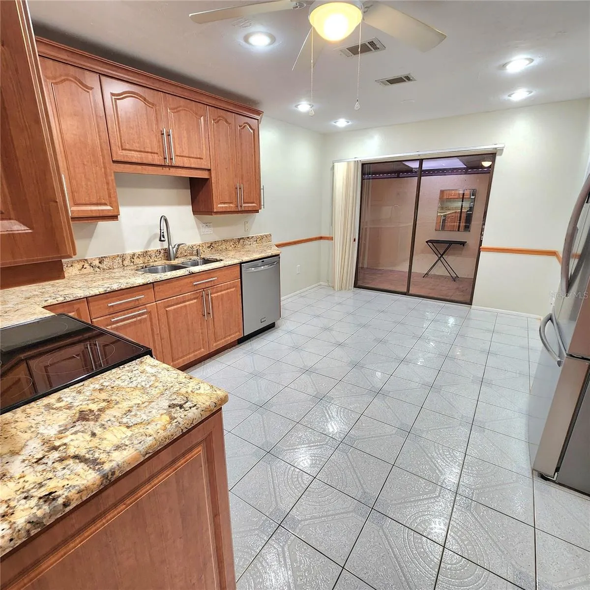 view to slider and eat in dinette area in kitchen