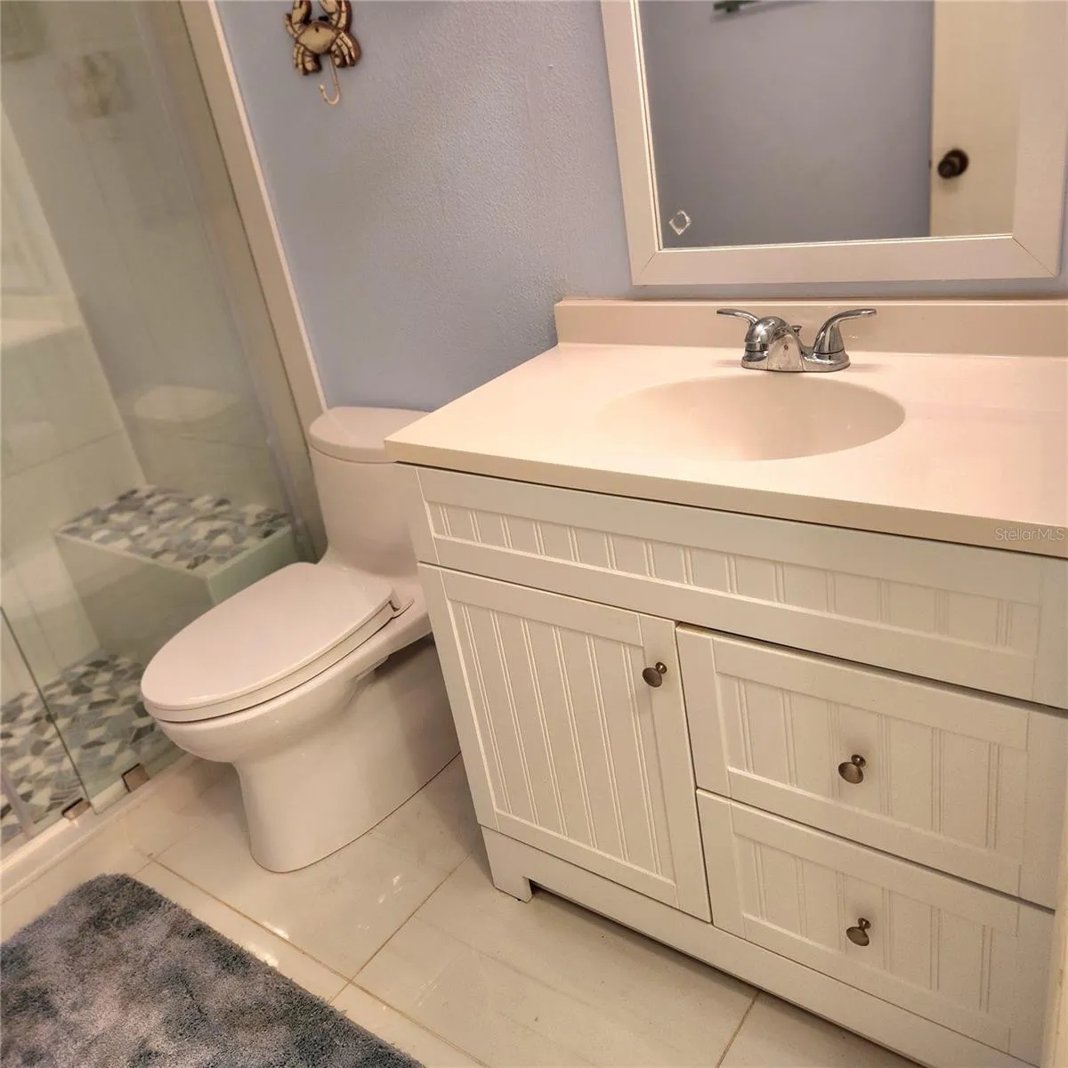 new toto toilet, vanity, flooring, shower and fixtures. ALL NEW