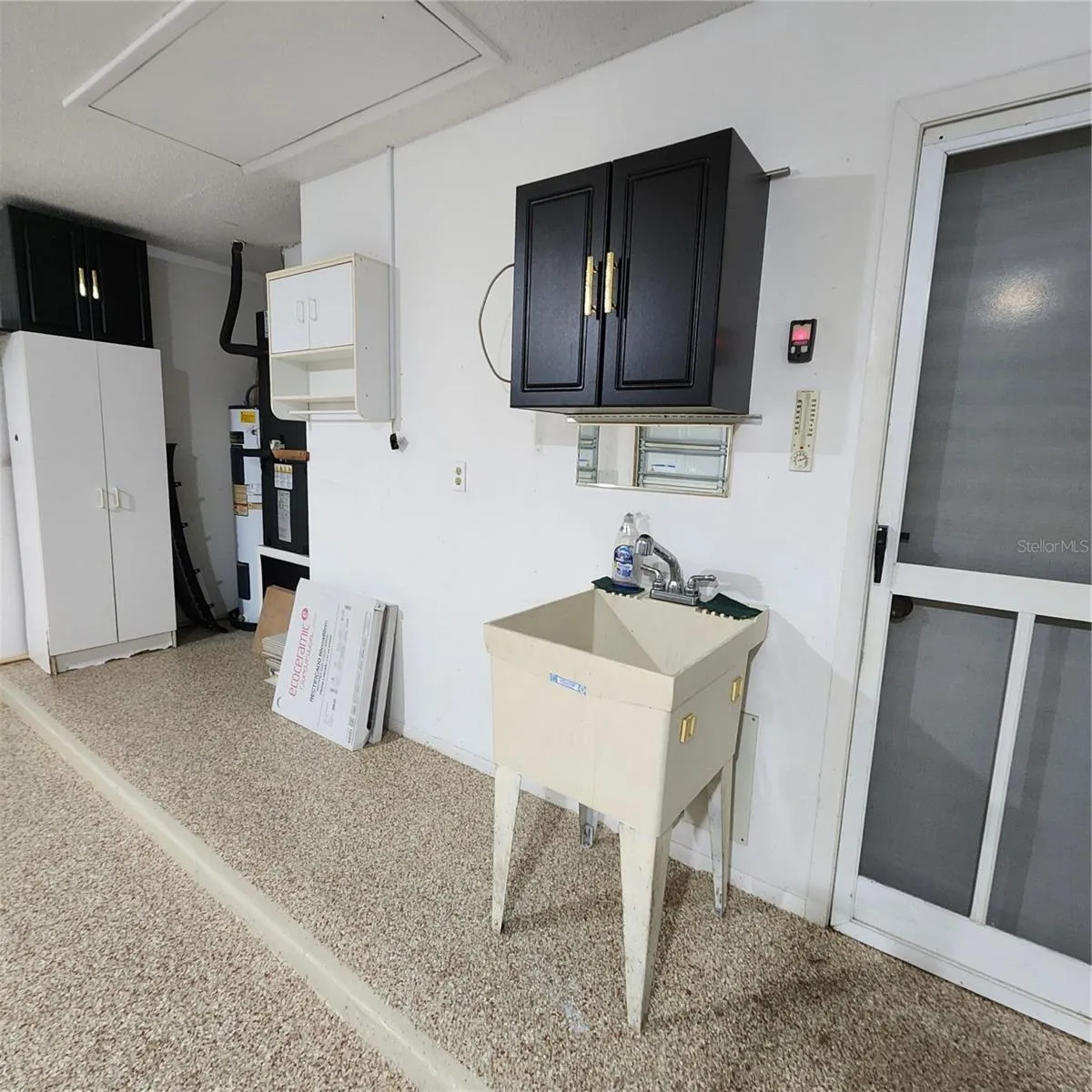 utility sink and cabinet