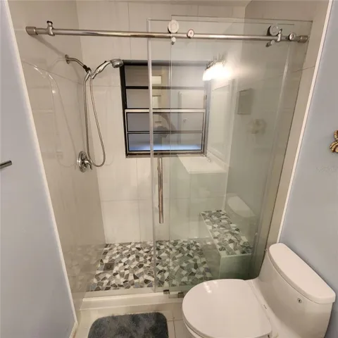 wall tile goes floor to ceiling