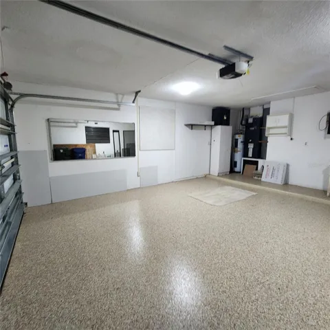 beautiful epoxy floor in garage and lots of spac