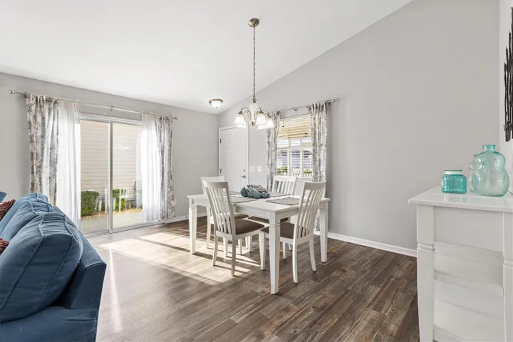 Dining Room w/ Sliding Door Access to Side Patio.