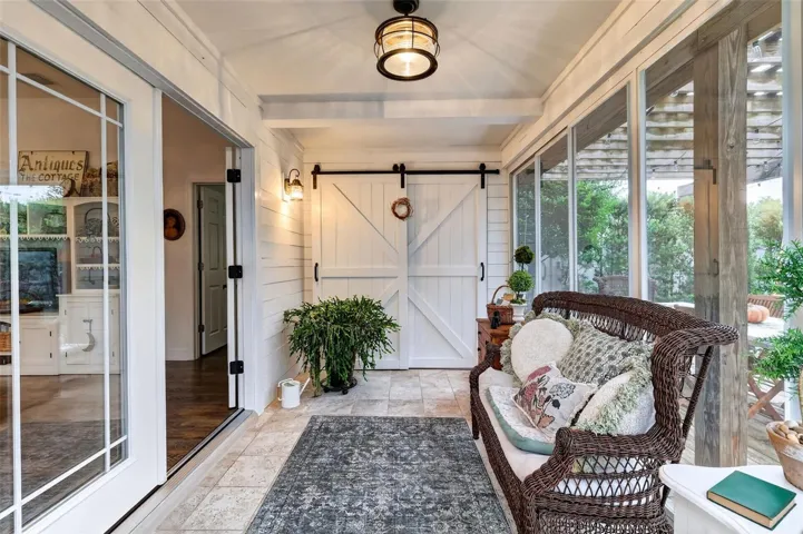 Enclosed Lanai with Barn Door to Sliding Door to Primary Bedroom