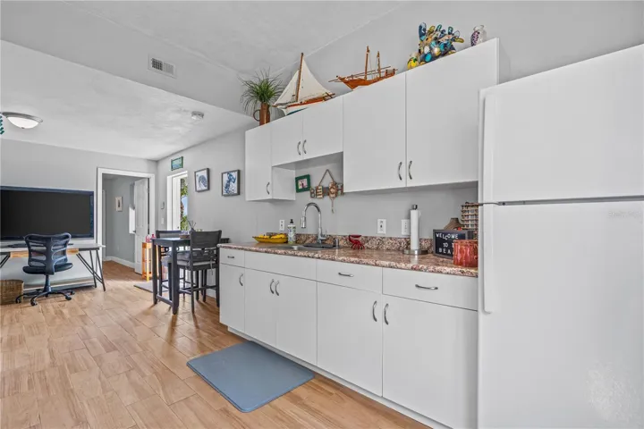 1st floor- Private entrance- View from main bedroom into kitchenette area (no stove)
