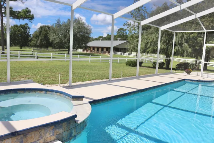 Watch your horses from your pool and spa