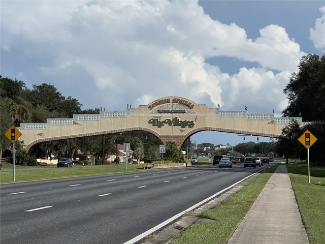 View of recently renovated VILLAGES GOLF CART BRIDGE across US HWY 441/27 - Note SPANISH SPRINGS TOWN CENTER is located on the west side of bridge (R turn at stoplight past the bridge).