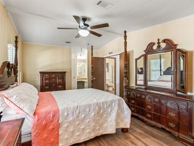 Another view of PRIMARY BEDRROOM - Shows ENSUITE BATHROOM (back Center L) and DOUBLE DOOR ENTRY to PRIMARY SUITE. Note BATHROOM #2 is visible through double doors (back Center R)