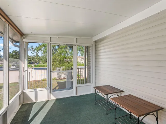 View of SCREEN ENCLOSED LANAI in rear of home. Note REAR PRIVACY due to CBS privacy wall.