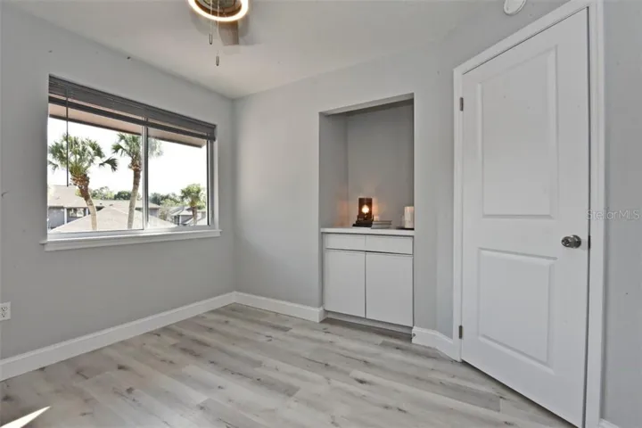 Bedroom #2 (11x11). All interior doors have been replaced with new modern two panel doors with new hinges and brushed nickel door handles.