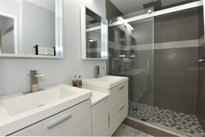 Completely re-build master bathroom with floating double sinks, stylish faucets, frameless sliding shower door, large walk-in shower with rain shower head. You have to come and see this luxurious master ensuite.