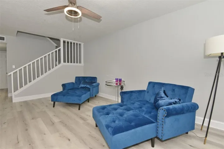 Spacious living room is 18.8 x 12.4