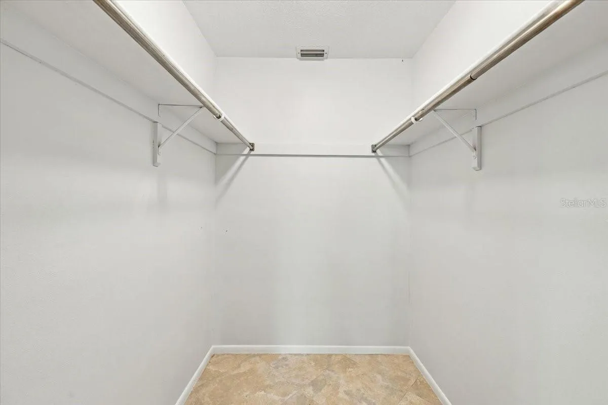 Walkin closet in primary bedroom