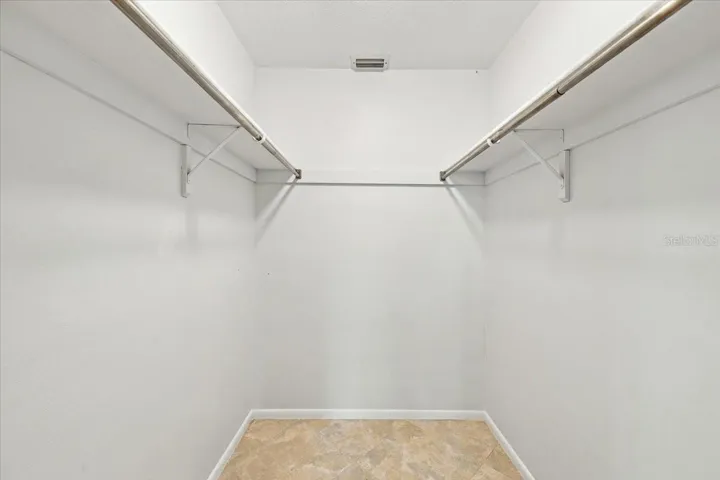 Walkin closet in primary bedroom