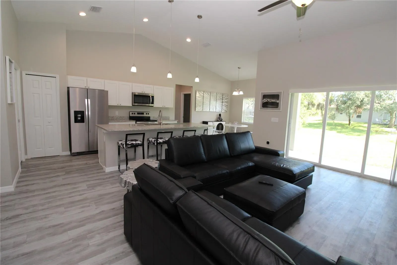 Vaulted Ceiling.... Plank Tile Flooring Throughout.....