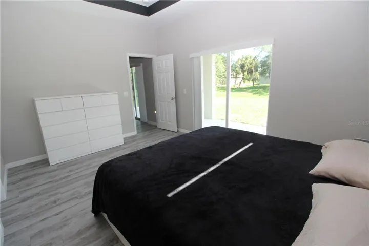 Primary Bedroom with sliding glass doors out to your private/covered lanai...