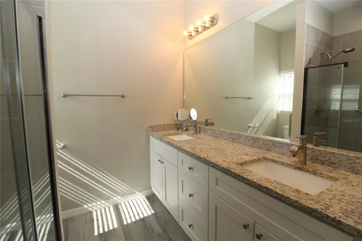 Primary Bathroom.... Long Vanity with dual sinks....