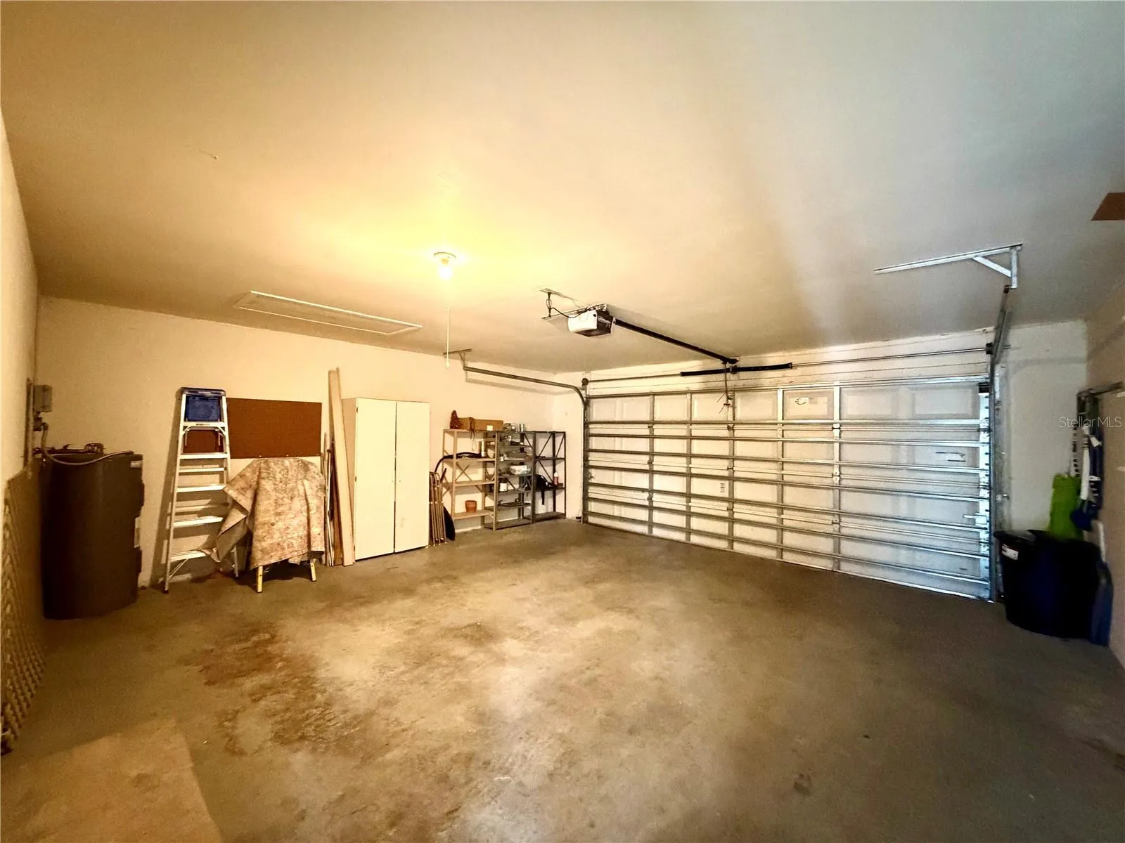 Over-sized garage and storage cabinets will remain with property