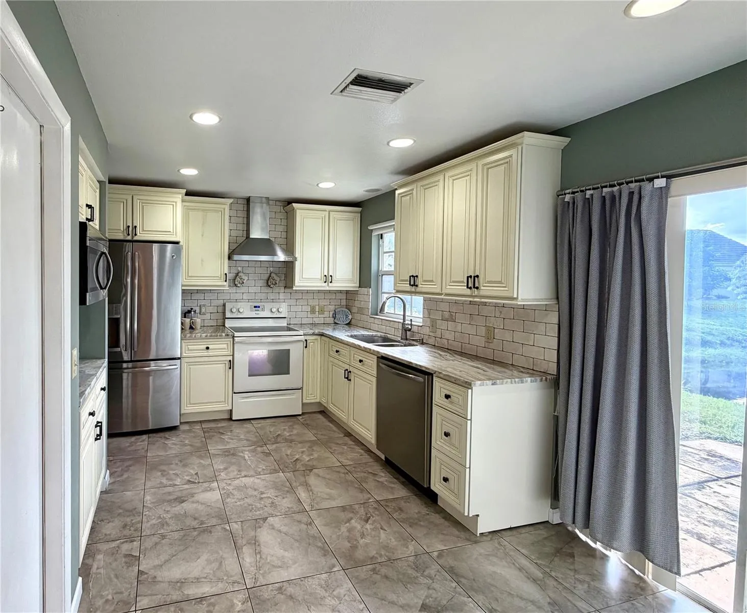 Updated kitchen with granite counters and penty of smart cabinet space for any chef